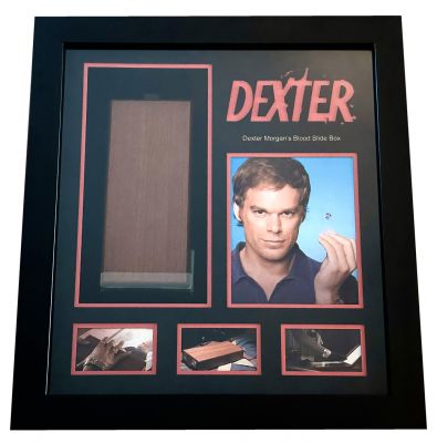 Dexterâ€™s (Michael C. Hall) Blood Slide Box
He's smart. He's lovable. He's Dexter Morgan; America's favorite serial killer, who spends his days solving crimes and committing them. This is Dexterâ€™s (Michael C. Hall) wooden blood slide box. This hero box was used during seasons 5-8. There were three boxes used during that time frame, this one, a stunt box containing plastic slides instead of glass and one was burned when he finally sent it through the incinerator. You see this specific box multiple times including when Debra finds this box and is waiting for him at his condo. This is one of the most recognizable and important pieces from plot of the Dexter series and contains several screen used glass blood slides inside. As Dexter kills each of his targets, he takes a drop of their blood and puts it on a slide to keep as a souvenir. 
Keywords: Dexterâ€™s (Michael C. Hall) Blood Slide Box
