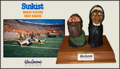 Sunkist Wacky Players TV Commercial Audience Members
In 1991 Vinton Studios did a series of Sunkist wacky players fun fruits commercials and trading cards. They were given several Jack Davis (also known as an artist in Mad Magazine) illustrations to use as guide material for the sculpts. The sets were really huge and back then covered almost everything with melted clay to give it that look. The roller was made of wood but it too was covered with Van Aken clay. The big guy in the red jersey flattens all the guys on the blue team. The audience is all clay with no armatures and the further back you get the simpler made they are to almost just blobs of clay. From the commercial, this is a couple of the audience member puppets seen closer to the front during the commercial which required them to be more detailed when originally fabricated.
Keywords: Sunkist Wacky Players TV Commercial Audience Members