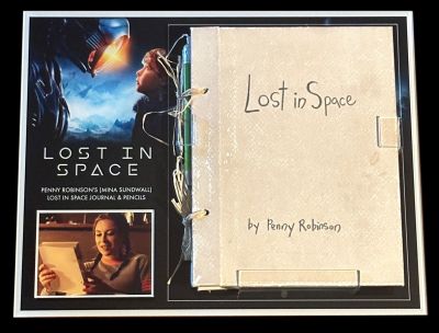 Penny Robinson's (Mina Sundwall) Lost in Space Travel Journal and Pencils
After crash-landing on an alien planet, the Robinson family fight against all odds to survive and escape, but they're surrounded by hidden dangers. From the Netflix series Lost in Space, this is Penny Robinson's (Mina Sundwall) Lost in Space journal and pencils. Penny consistently writes in her journal with the different day to day events they experience and in the Season 2 episode "Shipwrecked," Will (Maxwell Jenkins) gave the Robinsons copies of Penny's space travel journal as Christmas gifts.
Keywords: Penny Robinson&#039;s (Mina Sundwall) Lost in Space Travel Journal and Pencils