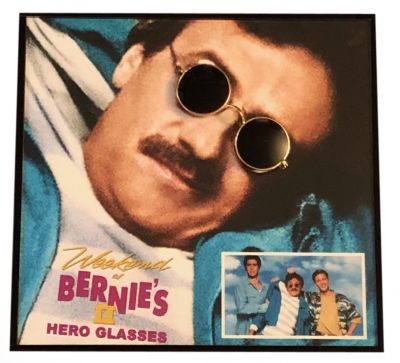 Bernie's (Terry Kiser) Sunglasses
After witnessing the murder of their corrupt boss, Bernie Lomax, Larry Wilson and Richard Parker are blamed for Bernie's embezzlement and fired. Desperate to find the stolen $2 million and clear their names, the pair learns the fortune was hidden in the Virgin Islands and travels there in pursuit. Meanwhile, Bernie's corpse is partially revived in a voodoo ceremony by gangsters also looking for the money. From the 1993 comedy Weekend at Bernieâ€™s II, this is Bernie Lomaxâ€™s (Terry Kiser) sunglasses worn throughout the film. These sunglasses are a major part of Bernieâ€™s wardrobe along with the dopey grin from the fatal injection, his sunglasses help conceal his lifeless state.
Keywords: Bernie's (Terry Kiser) Sunglasses