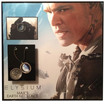 Max Da Costa's (Matt Damon) Locket
Max Da Costa's (Matt Damon) Locket from Neil Blomkamp's 2013 dystopian thriller, Elysium. In the distant future, Earth has become an overpopulated wasteland for the poor, while the wealthy live above in a utopian space station known as Elysium. When a factory worker named Max is exposed to a lethal dose of radiation on Earth, he embarks on a dangerous mission to infiltrate Elysium in order to obtain a cure before it's too late. Max is given a locket as a child, and holds onto it throughout the film. This particular style of the locket features a brown leather cord, indication that it was held by Max as an adult, rather than in the early scenes in which it has a metal chain. The locket features a metal casing with multiple crosses engraved on the inside of the lid. Inside the locket is a small photograph of the planet earth, to remind Max of where he came from.
Keywords: Max Da Costa's (Matt Damon) Locket